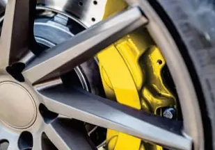 Caliper painting in Catford: painted brake caliper behind an alloy wheel